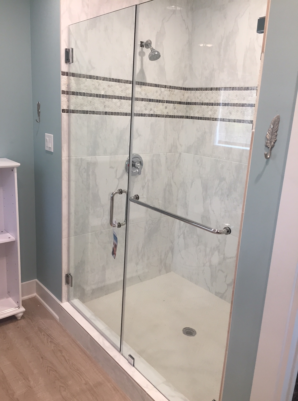 Semi-Frameless Door with Towel Bar installed by Texan Glass in The Woodlands, TX