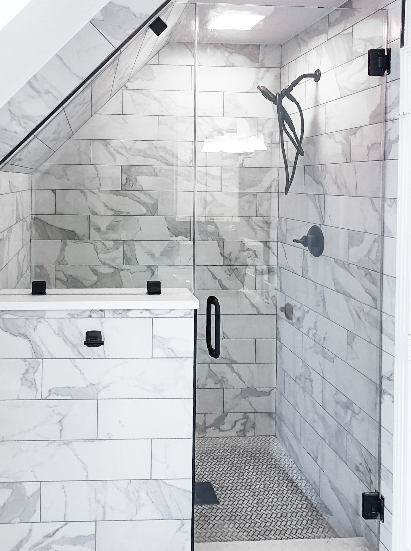 Sloped-Ceiling Marble Shower installed by Texan Glass in The Woodlands, TX